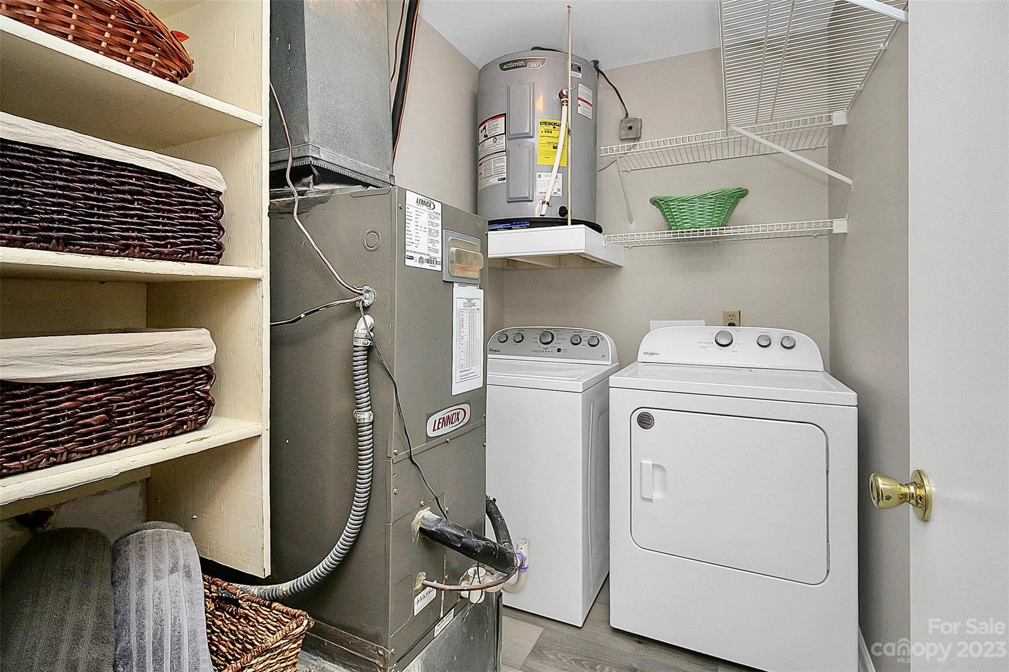 430 Queens Road, Unit 212 Charlotte, NC 28207 - Photo 9 of 23 a utility room with dryer and washer
