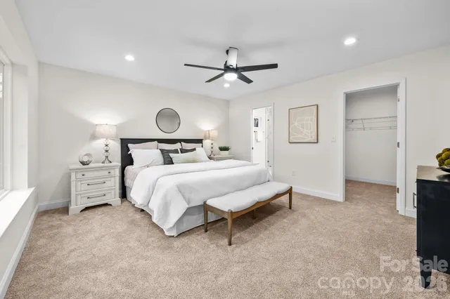 a bedroom with a bed and a tv