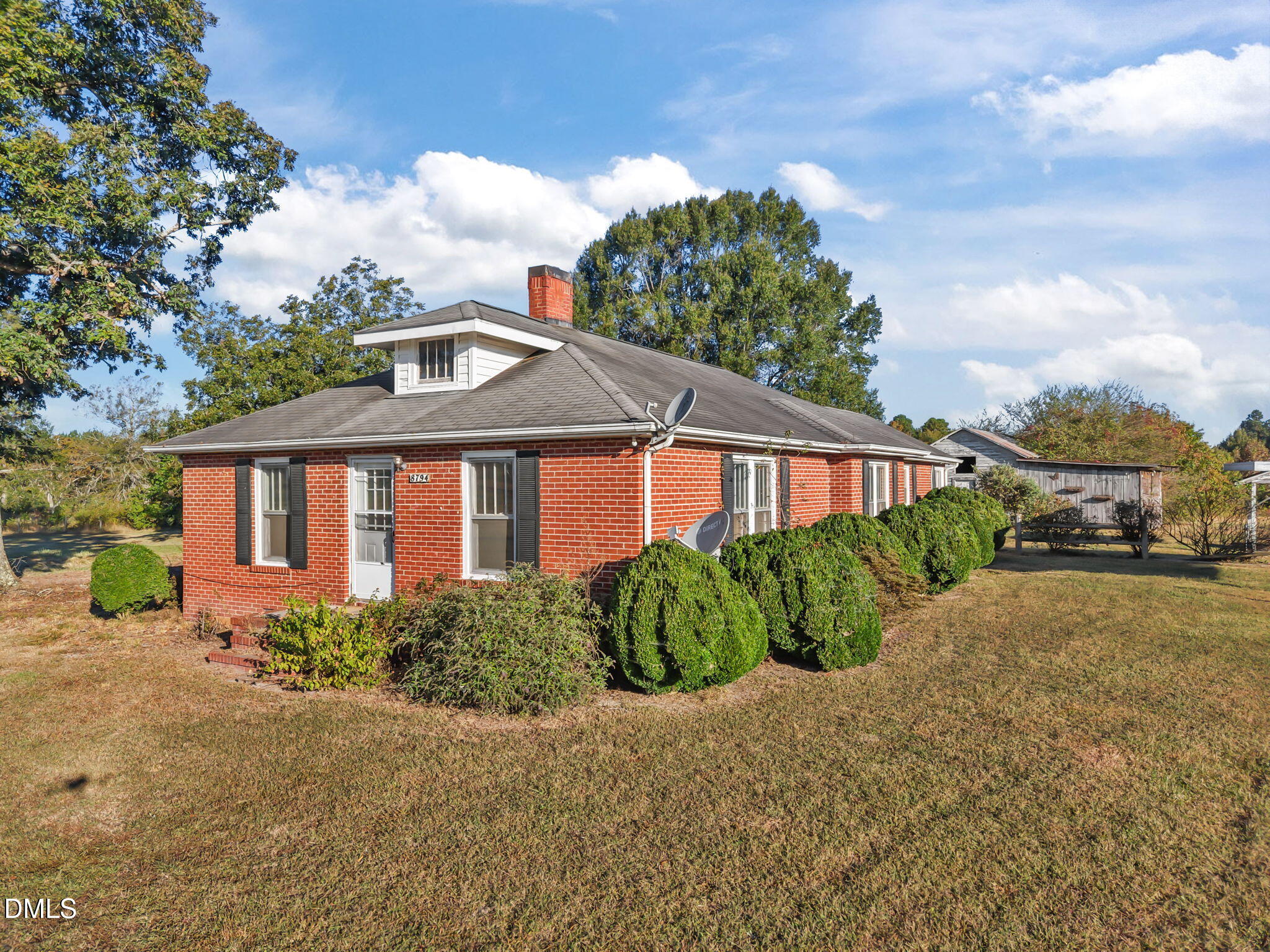 8794 Old 421 Road Julian, NC 27283 - Photo 6 of 24 a front view of a house with garden