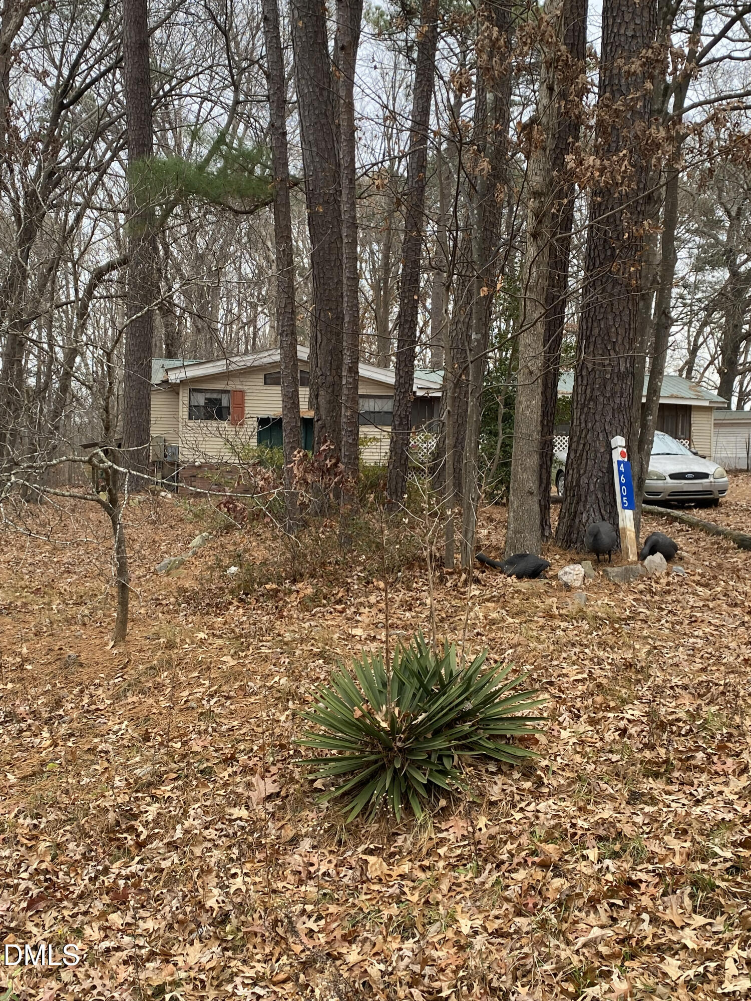 4605 Graham Newton Road Raleigh, NC 27606 - Photo 3 of 10 a backyard of a house with table and chairs