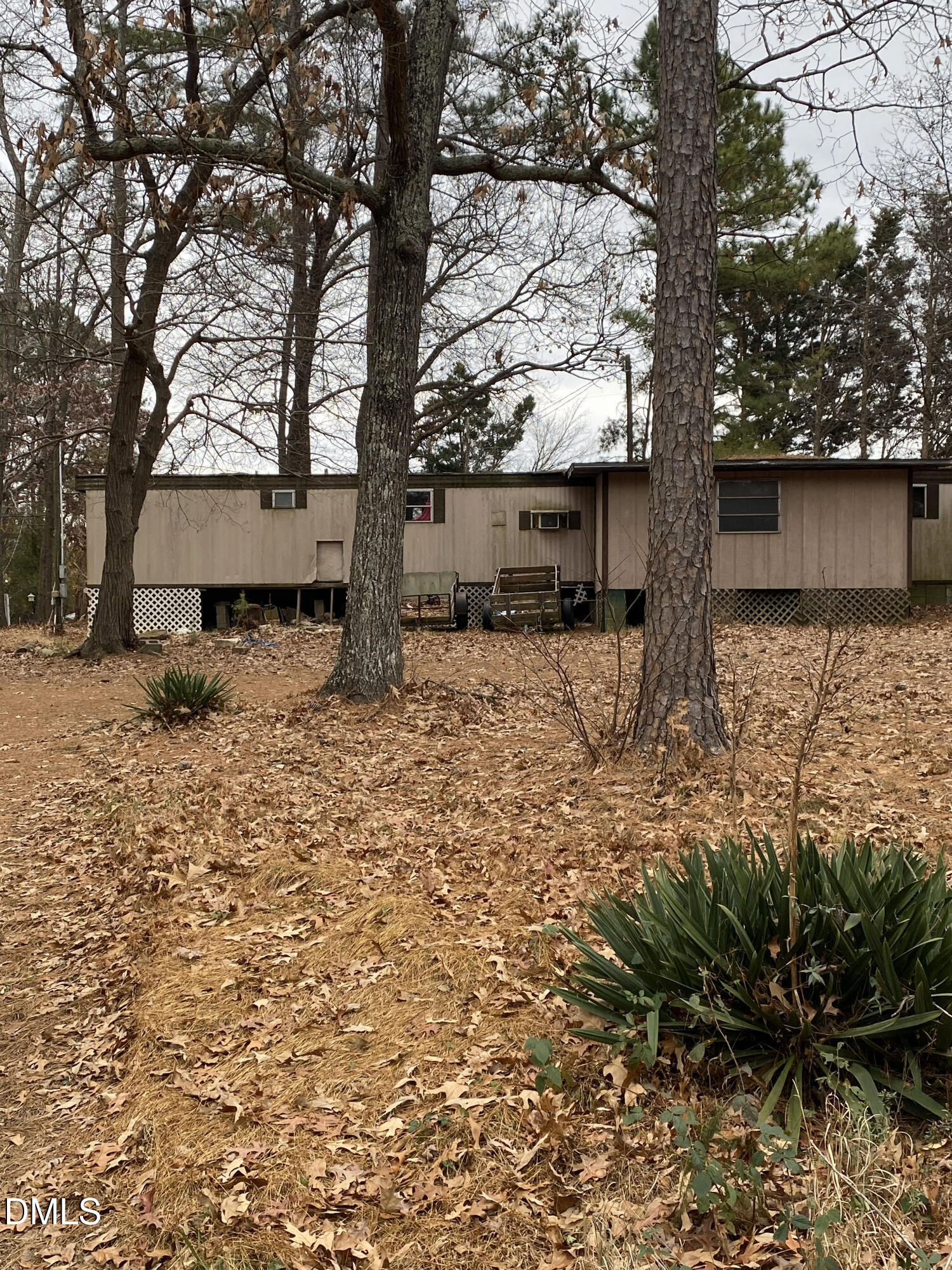 4605 Graham Newton Road Raleigh, NC 27606 - Photo 5 of 10 a backyard of a house with lots of green space