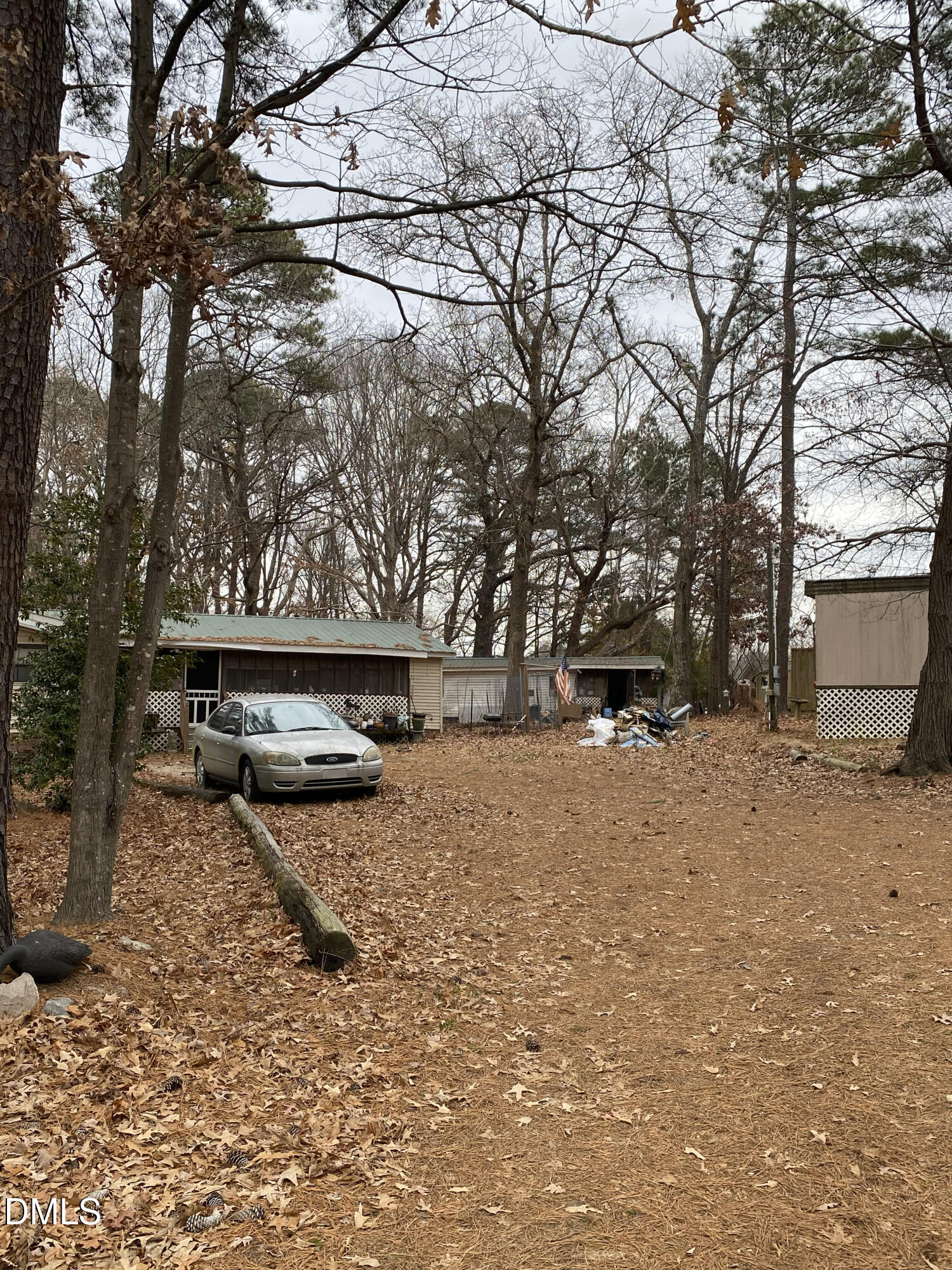 4605 Graham Newton Road Raleigh, NC 27606 - Photo 10 of 10 a backyard of a house with barbeque oven table and chairs