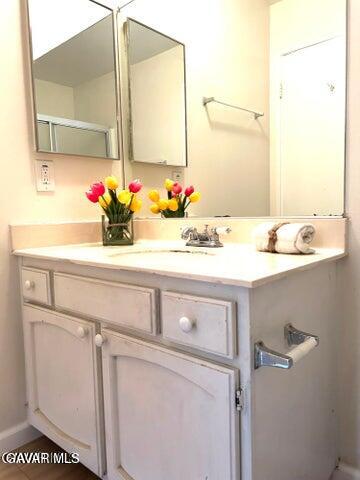 38710 10th Street East, Unit 12 Palmdale, CA 93550 - Photo 15 of 23 a bathroom with a sink and a mirror