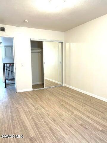 38710 10th Street East, Unit 12 Palmdale, CA 93550 - Photo 16 of 23 a view of empty room with wooden floor