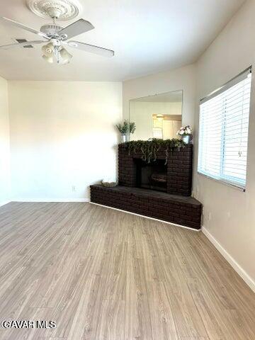 38710 10th Street East, Unit 12 Palmdale, CA 93550 - Photo 4 of 23 a living room with hard wood floors