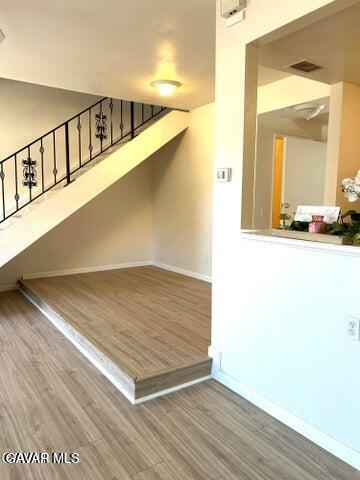 38710 10th Street East, Unit 12 Palmdale, CA 93550 - Photo 7 of 23 a view of a hallway with an entryway