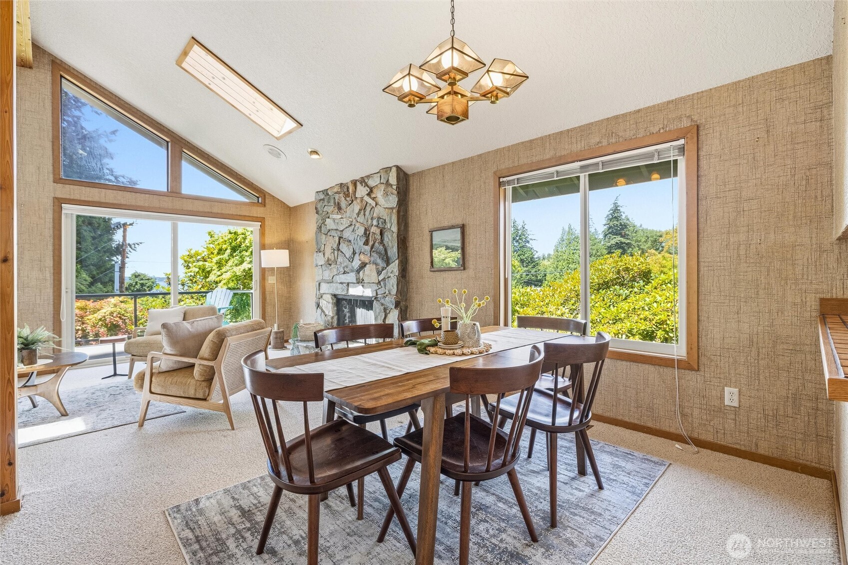 601 Clark Road Bellingham, WA 98225 - Photo 8 of 38 a view of a dining room with furniture a chandelier and wooden floor