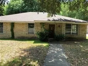 a view of a house with a yard and garage