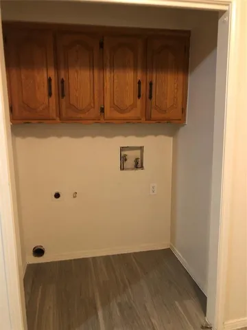 a view of a microwave and cabinets
