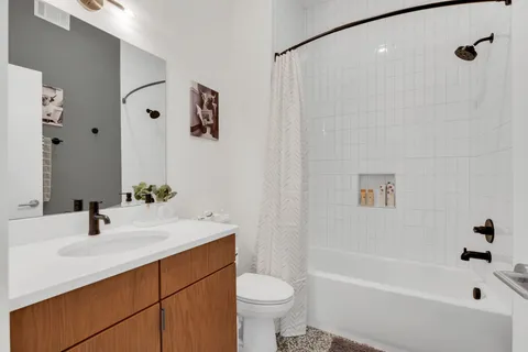 a bathroom with a sink a toilet and a bathtub