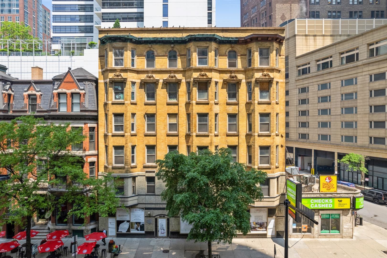 58 East Chicago Avenue Chicago, IL 60611 - Photo 3 of 27 a view of a building with a lot of windows and a yard
