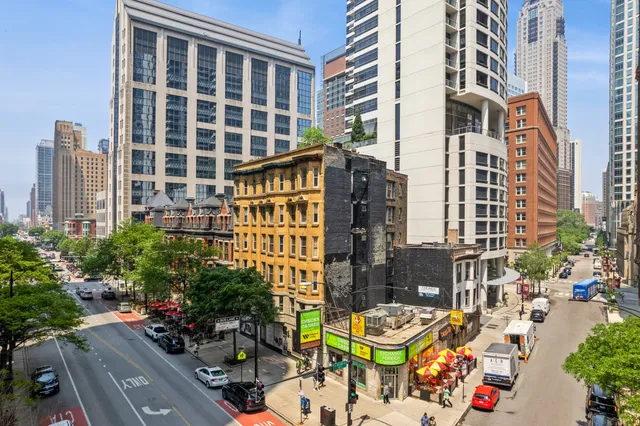 front view of a building with potted plants