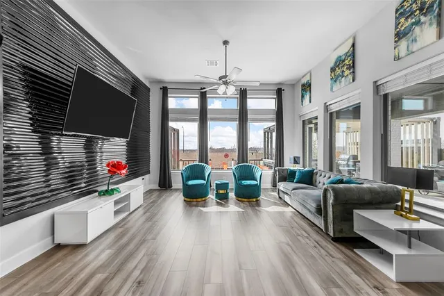 a living room with furniture fireplace and flat screen tv