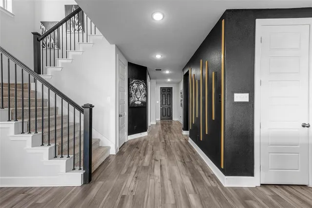 a view of gallery with wooden floor