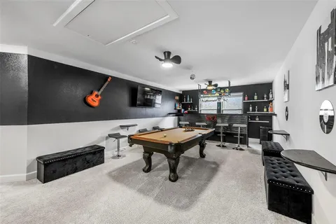 a living room with furniture pool and a table