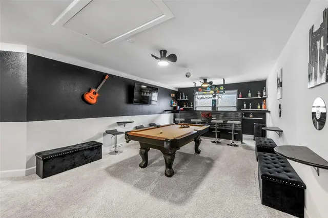 a living room with furniture pool and a table