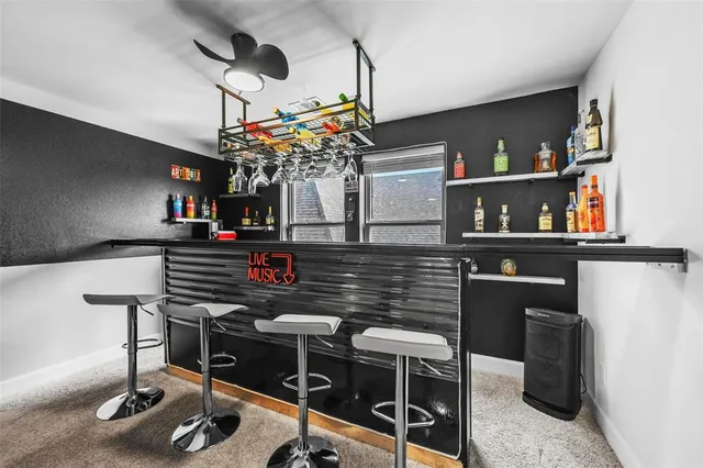 a room with furniture pool table and flat screen tv