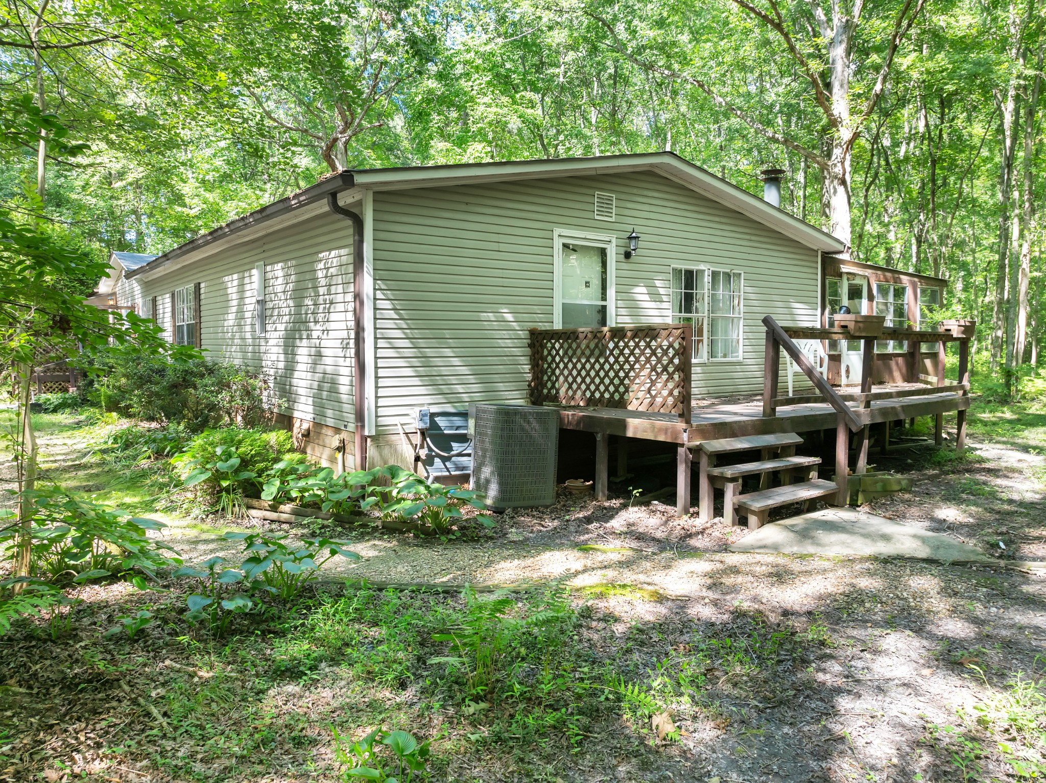 2635 Pete Sain Road Manchester, TN 37355 - Photo 3 of 52 a backyard of a house with table and chairs