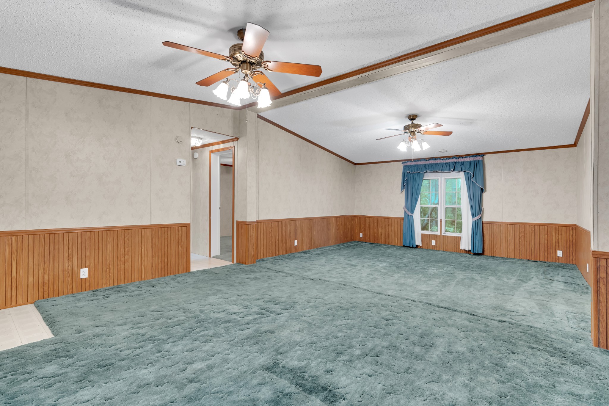 2635 Pete Sain Road Manchester, TN 37355 - Photo 33 of 52 a view of an empty room with a chandelier fan