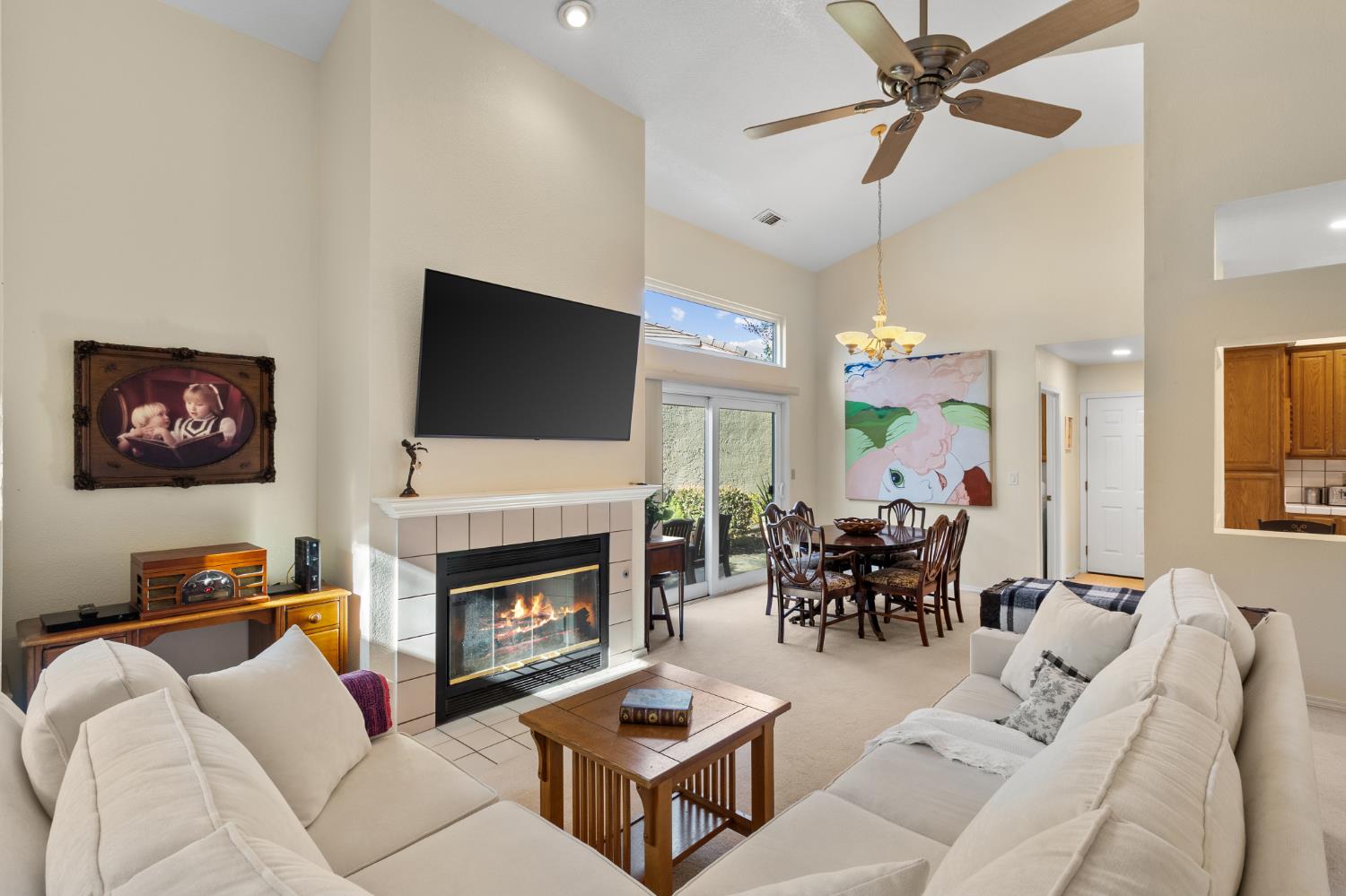 1153 Copper Lantern Court Modesto, CA 95355 - Photo 17 of 37 a living room with furniture fireplace and a flat screen tv