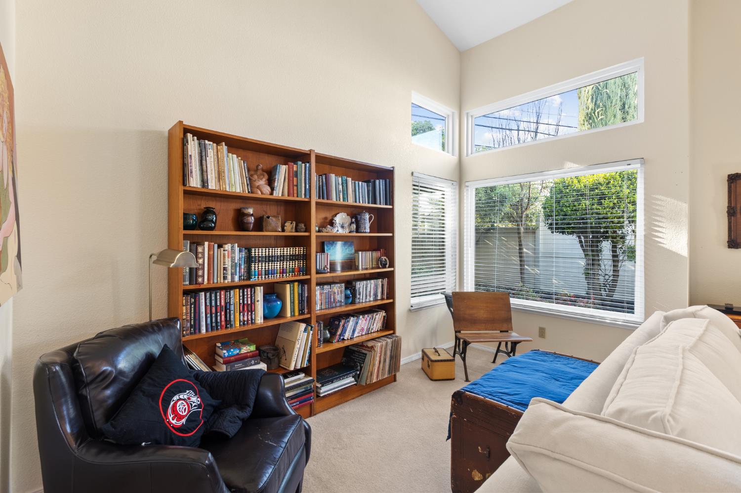 1153 Copper Lantern Court Modesto, CA 95355 - Photo 18 of 37 a living room with furniture and a book shelf
