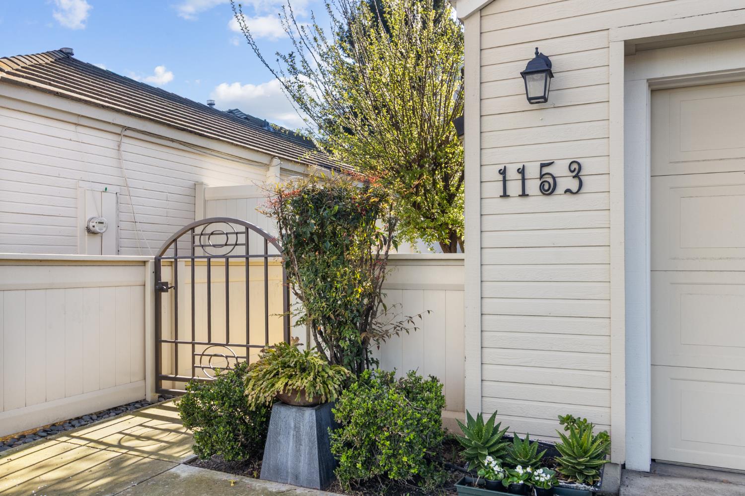 1153 Copper Lantern Court Modesto, CA 95355 - Photo 2 of 37 a view of entrance gate of a house
