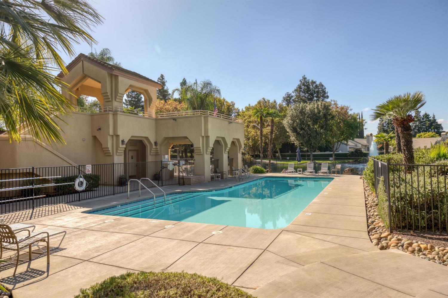 1153 Copper Lantern Court Modesto, CA 95355 - Photo 35 of 37 a view of a white house with a yard and plants