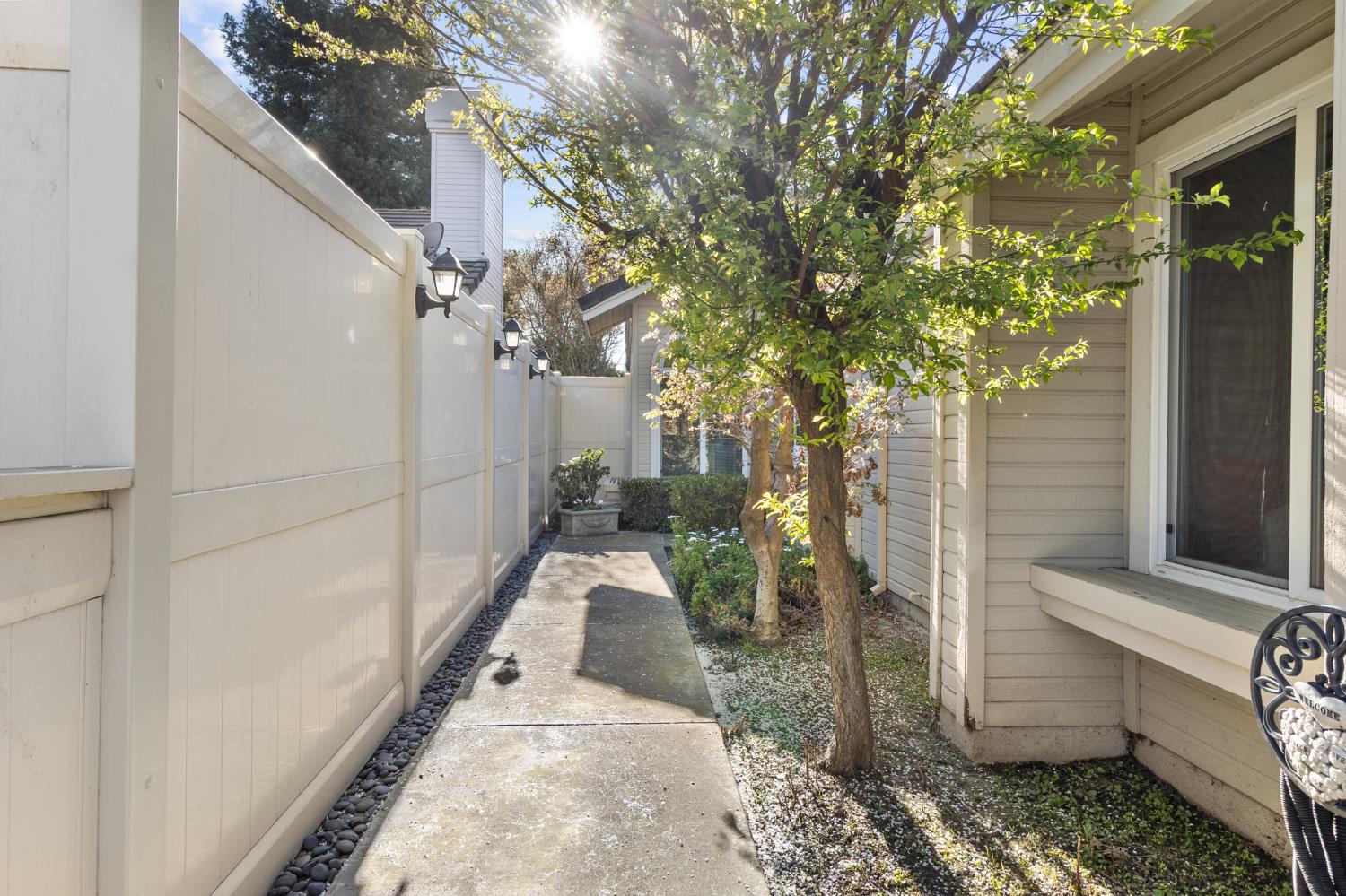 1153 Copper Lantern Court Modesto, CA 95355 - Photo 6 of 37 a view of a pathway of a house with a yard