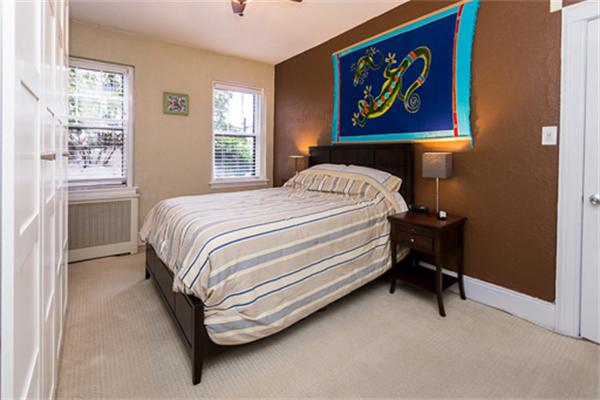 8 Chiswick Road, Unit 7 Boston, MA 02135 - Photo 11 of 18 a bedroom with a bed and a painting on the wall