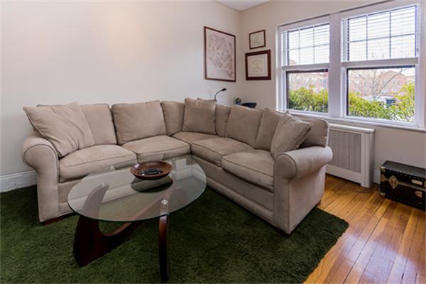 8 Chiswick Road, Unit 7 Boston, MA 02135 - Photo 3 of 18 a living room with furniture and a window