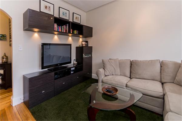 8 Chiswick Road, Unit 7 Boston, MA 02135 - Photo 4 of 18 a living room with furniture and a flat screen tv