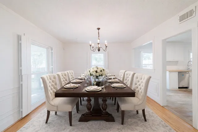 a view of an empty room and wooden floor