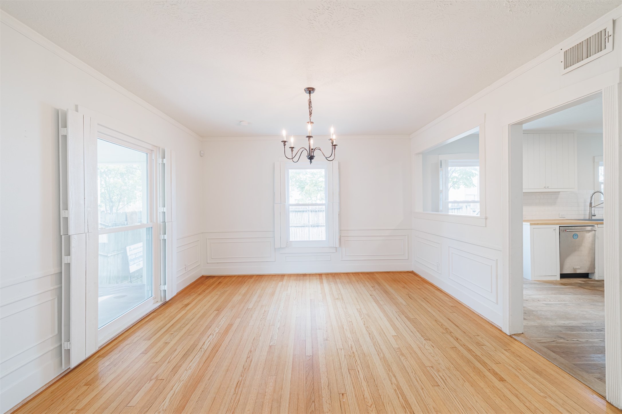2438 Albans Road Houston, TX 77005 - Photo 12 of 34 wooden floor in an empty room with a window