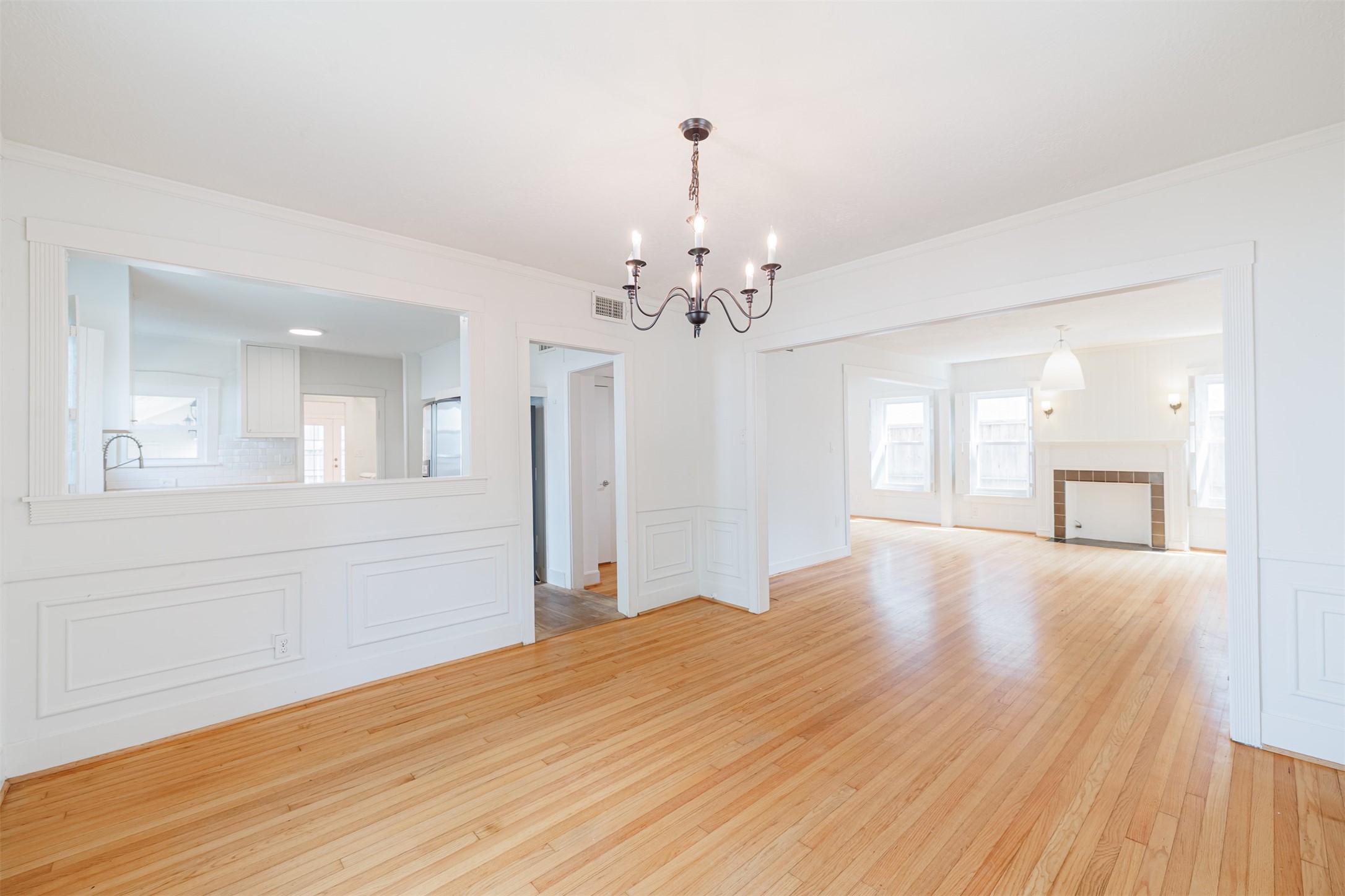 2438 Albans Road Houston, TX 77005 - Photo 13 of 34 a view of livingroom with chandelier and wooden floor