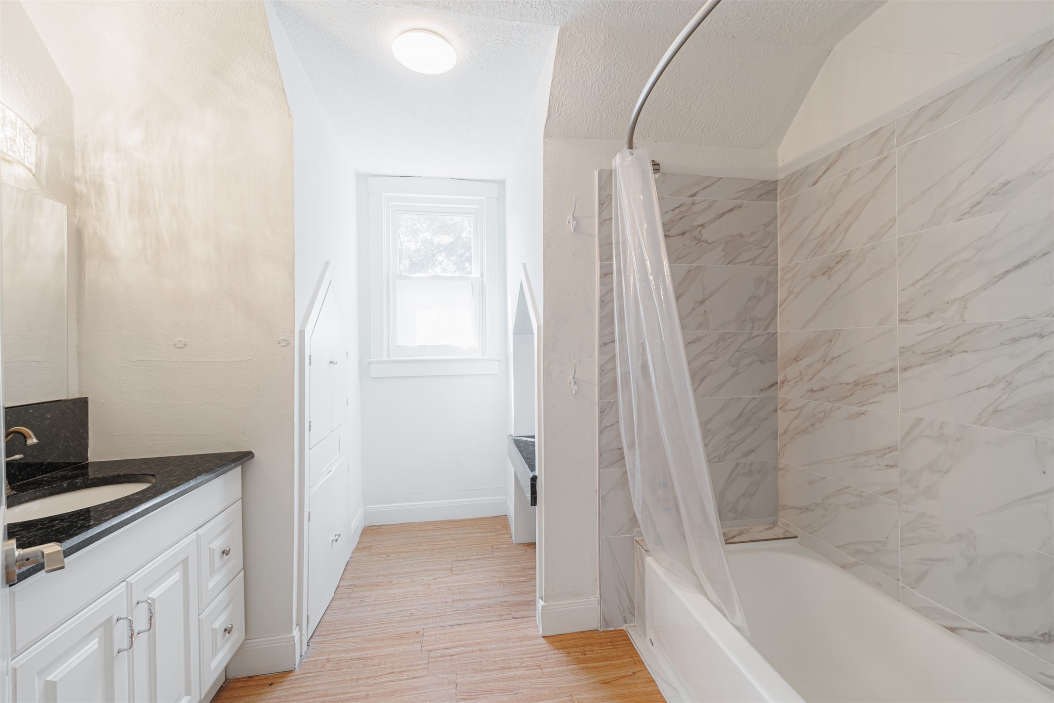 2438 Albans Road Houston, TX 77005 - Photo 25 of 34 a bathroom with a bathtub and a sink
