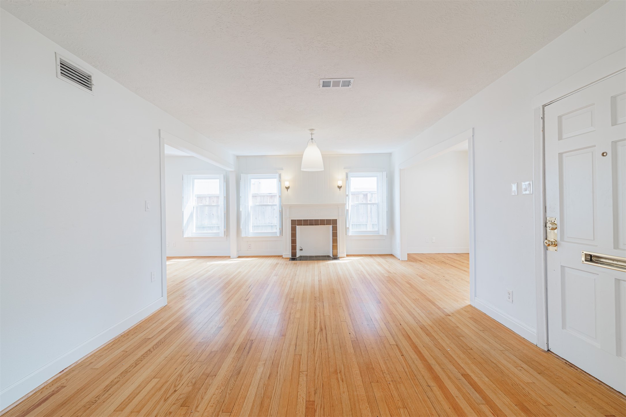 2438 Albans Road Houston, TX 77005 - Photo 4 of 34 wooden floor in an empty room with a window