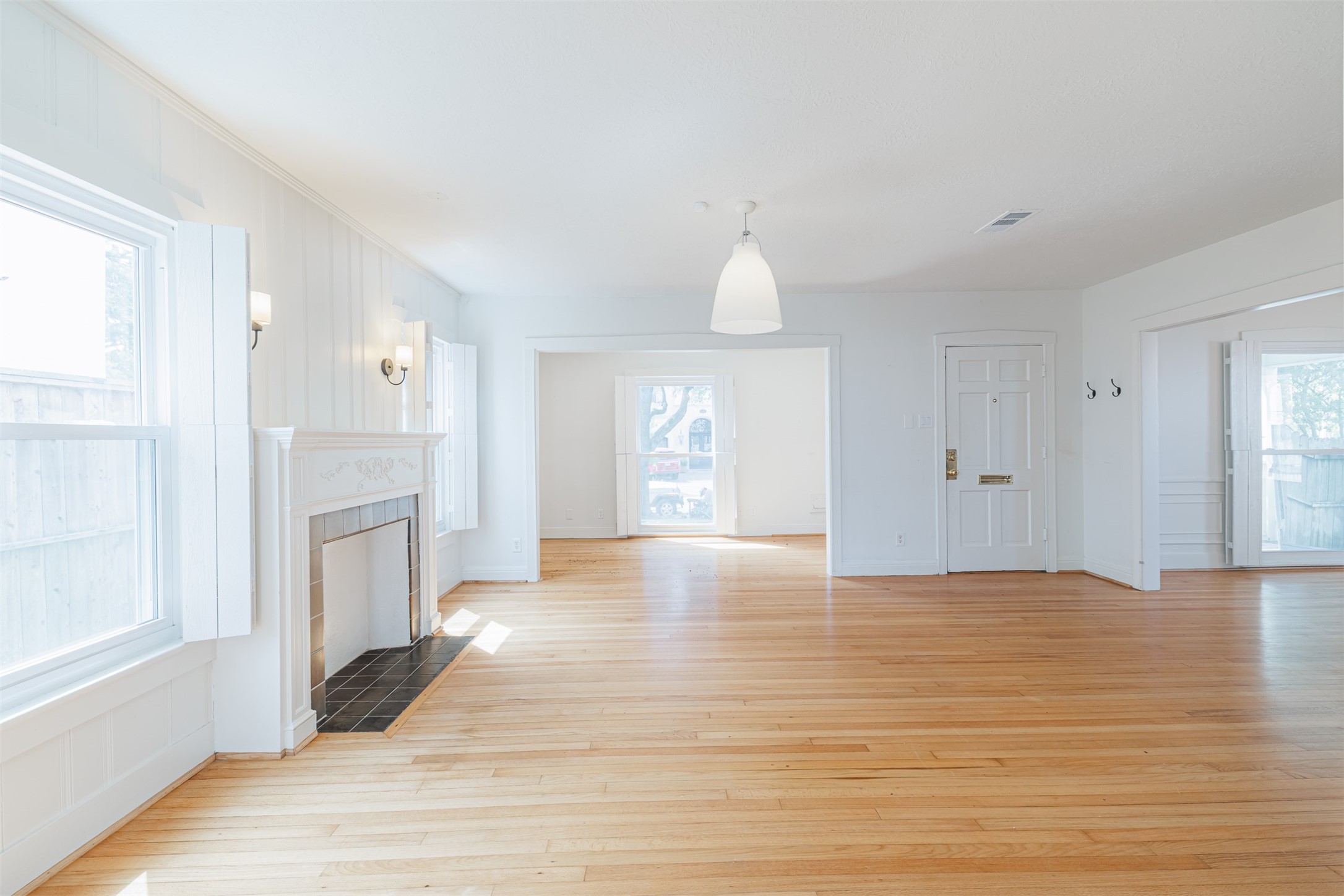 2438 Albans Road Houston, TX 77005 - Photo 6 of 34 a view of an empty room with window and wooden floor