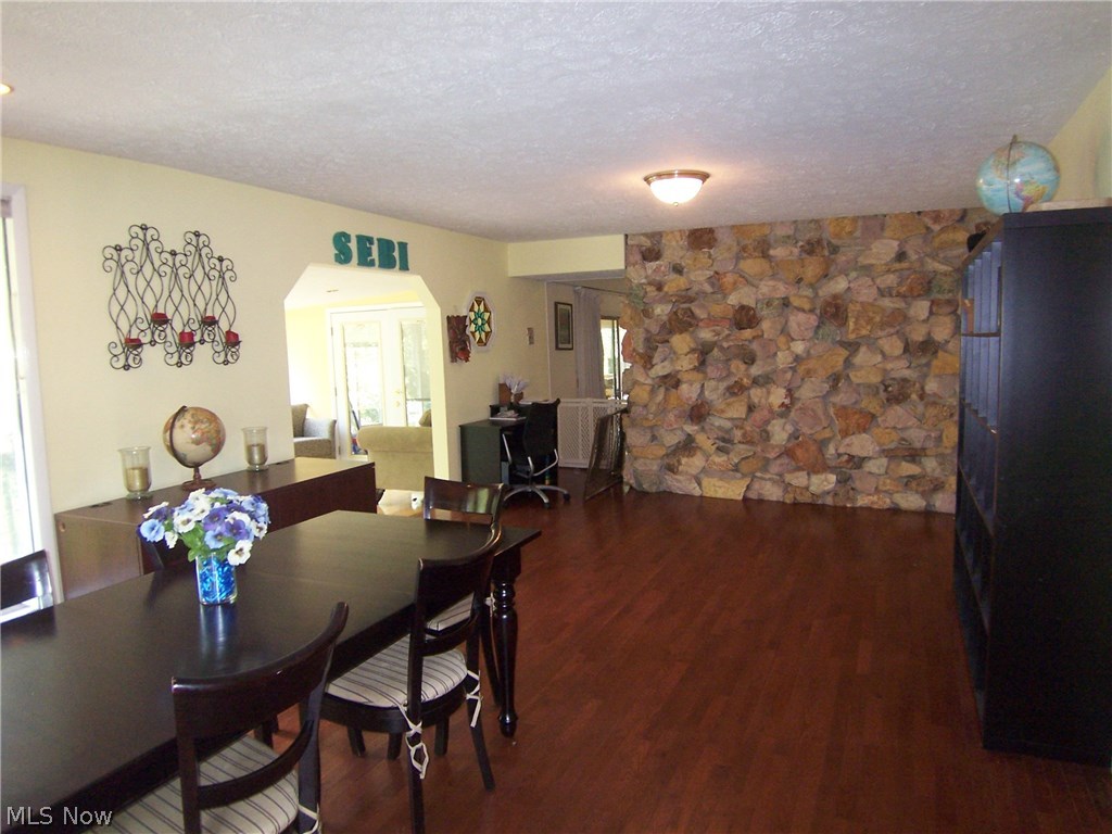 122 Rector Road Parkersburg, WV 26104 - Photo 5 of 35 The dining room features the stone back wall of the livingroom fireplace. Notice entry to the one of two sunrooms on the left.