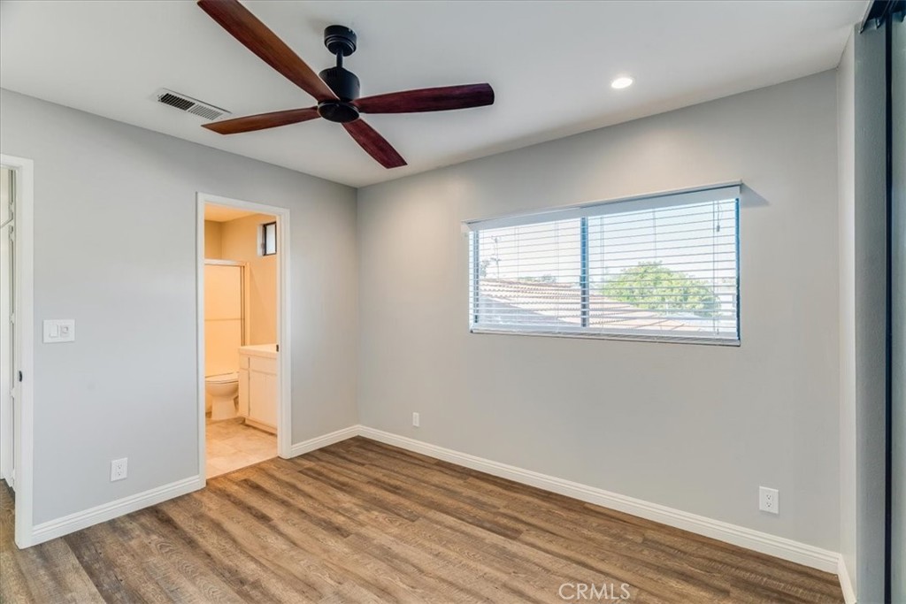 436 South Oak Park Boulevard, Unit 8 Grover Beach, CA 93433 - Photo 14 of 26 a view of empty room with wooden floor and fan