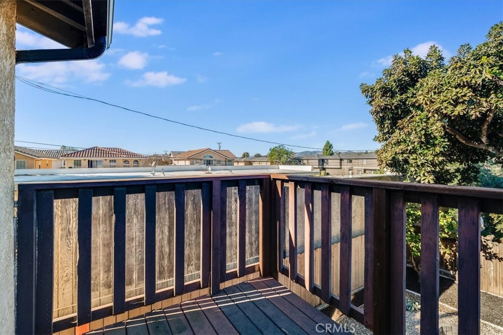 436 South Oak Park Boulevard, Unit 8 Grover Beach, CA 93433 - Photo 17 of 26 a view of a balcony with wooden fence