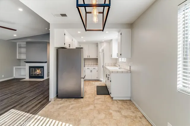 a view of a kitchen with a sink and a window