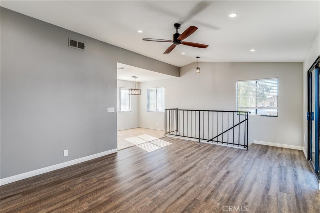 436 South Oak Park Boulevard, Unit 8 Grover Beach, CA 93433 - Photo 8 of 26 a view of a hallway with wooden floor and a ceiling fan