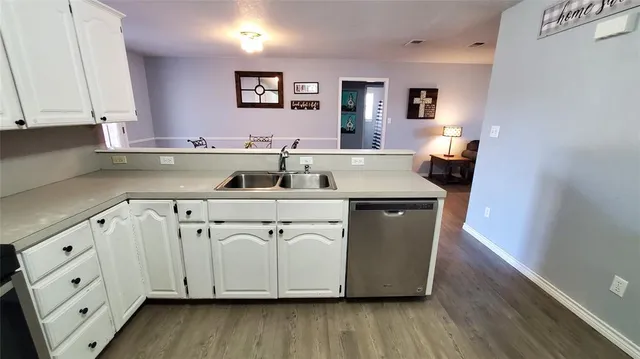 a view of a livingroom with furniture and a window