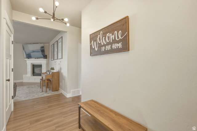 836 South 250 West Vernal, UT 84078 - Photo 5 of 56 Corridor featuring light wood-type flooring and a chandelier