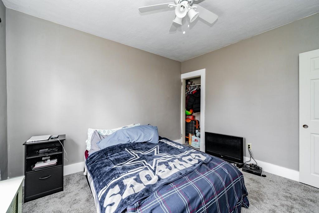 47 Richelieu Street Chicopee, MA 01020 - Photo 18 of 34 a bedroom with a bed and a tv