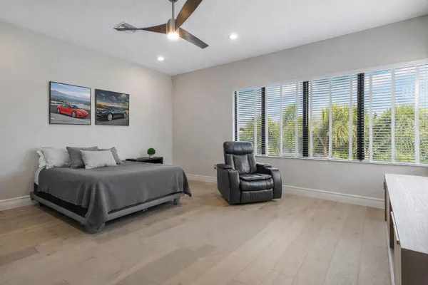 a bathroom with a shower and closet