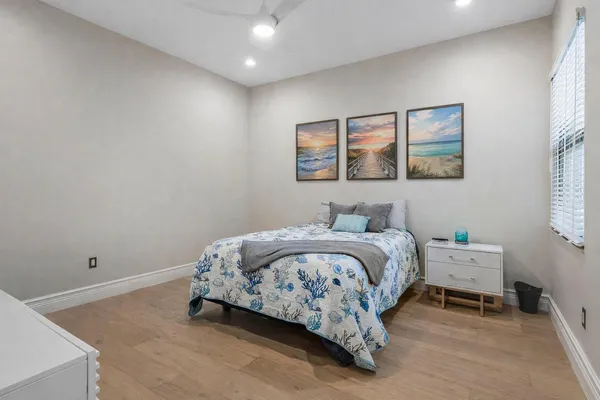a view of staircase with wooden floor and windows