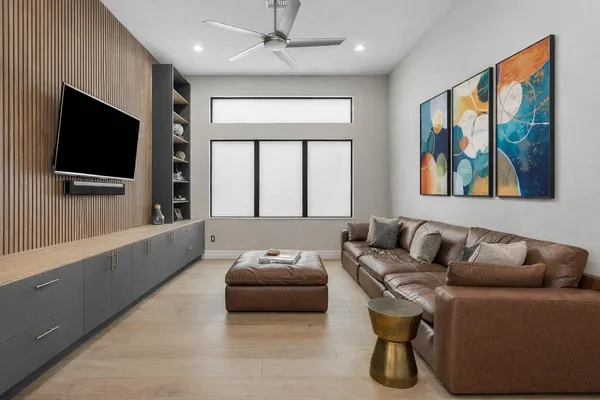 a bathroom with a granite countertop sink a toilet and a mirror