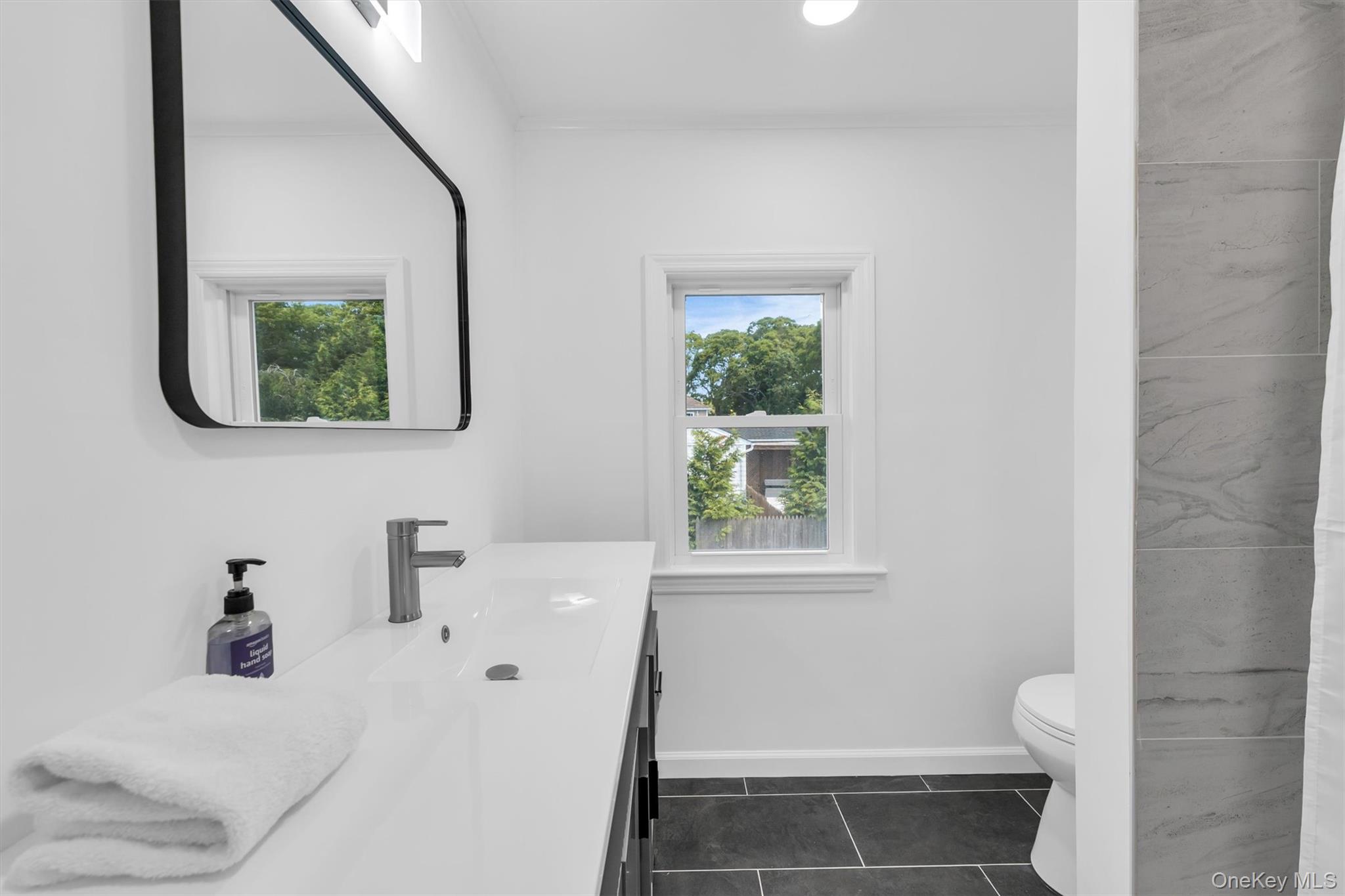 8 North Westbury Road Hampton Bays, NY 11946 - Photo 31 of 50 jack and Jill bathroom for bedroom 2 and 3