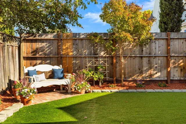 a view of a house with backyard porch and sitting area